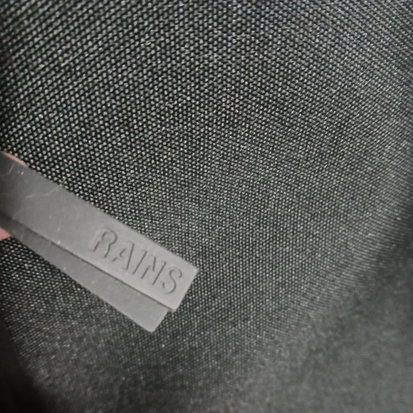 Rains Black Minimalist Backpack with Flap Closure